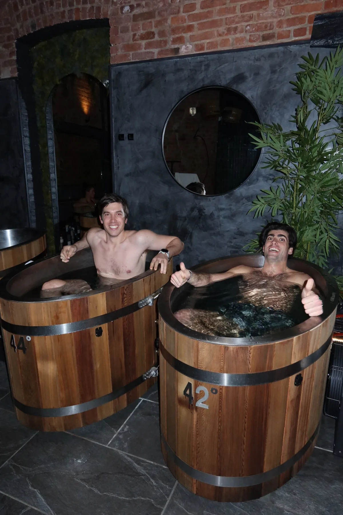 @vito999 enjoying a cold plunge sessions in wooden tubs at Kove Studio during the Storytime Wellness Reset Event. The spa-like setting highlights contrast therapy and recovery-focused experiences.