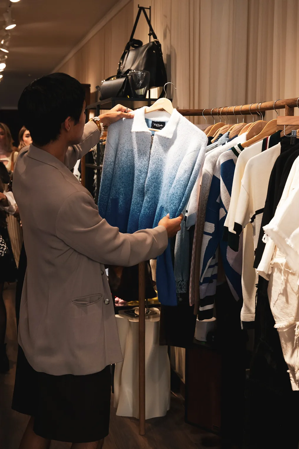 A guest browses fashion pieces during the Colombiamoda Oficial launch event hosted with Storytime at The Canvas NYC.