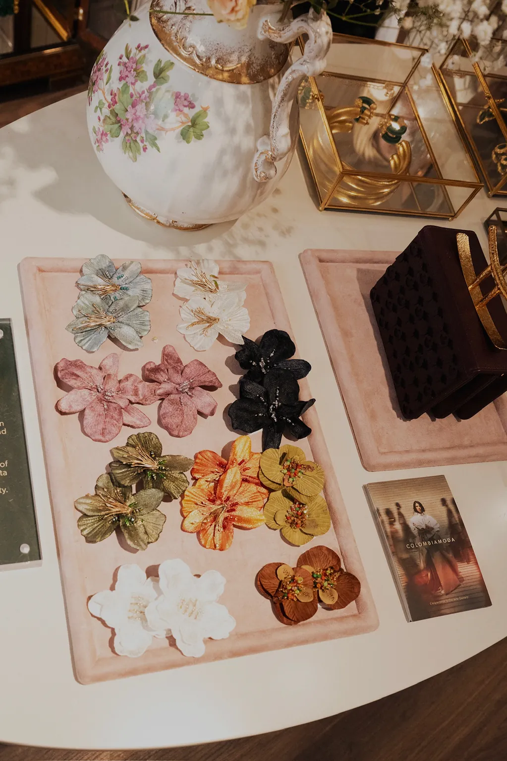 Colorful handcrafted floral accessories and jewelry displayed at the Colombiamoda Oficial x Storytime fashion launch event in NYC.