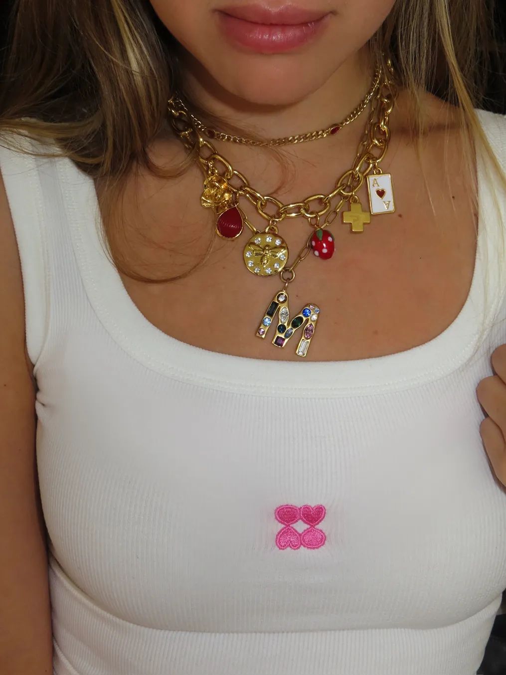 A guest wears layered jewelry and Storytime-branded apparel during the Bedford Studios NYC collaboration event in the West Village.