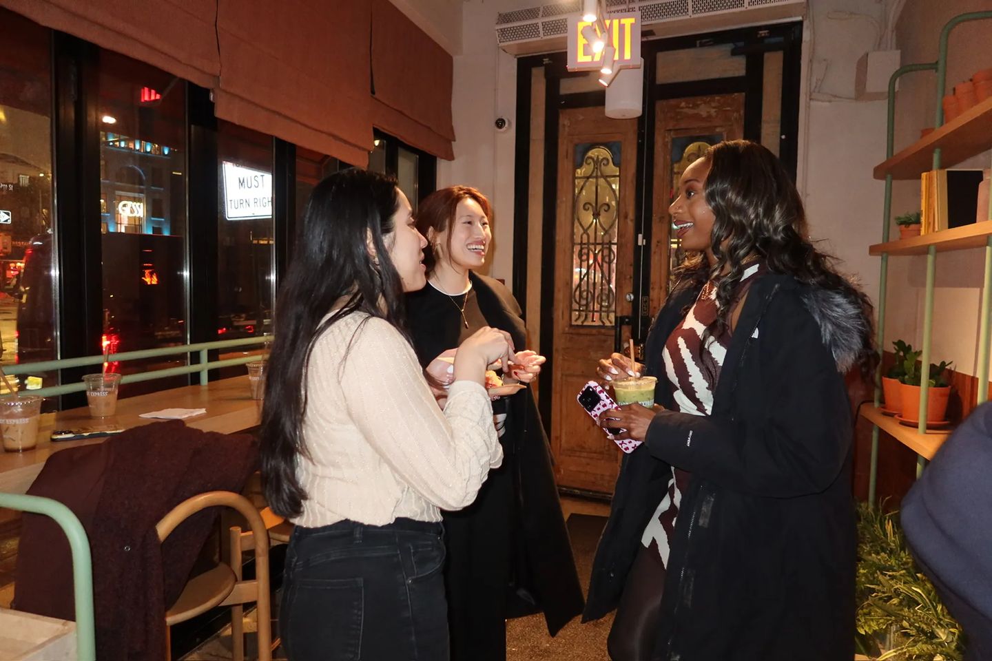 Guests chat and enjoy drinks while networking during the Storytime celebration at the new Carrot Express NoLita location in NYC.