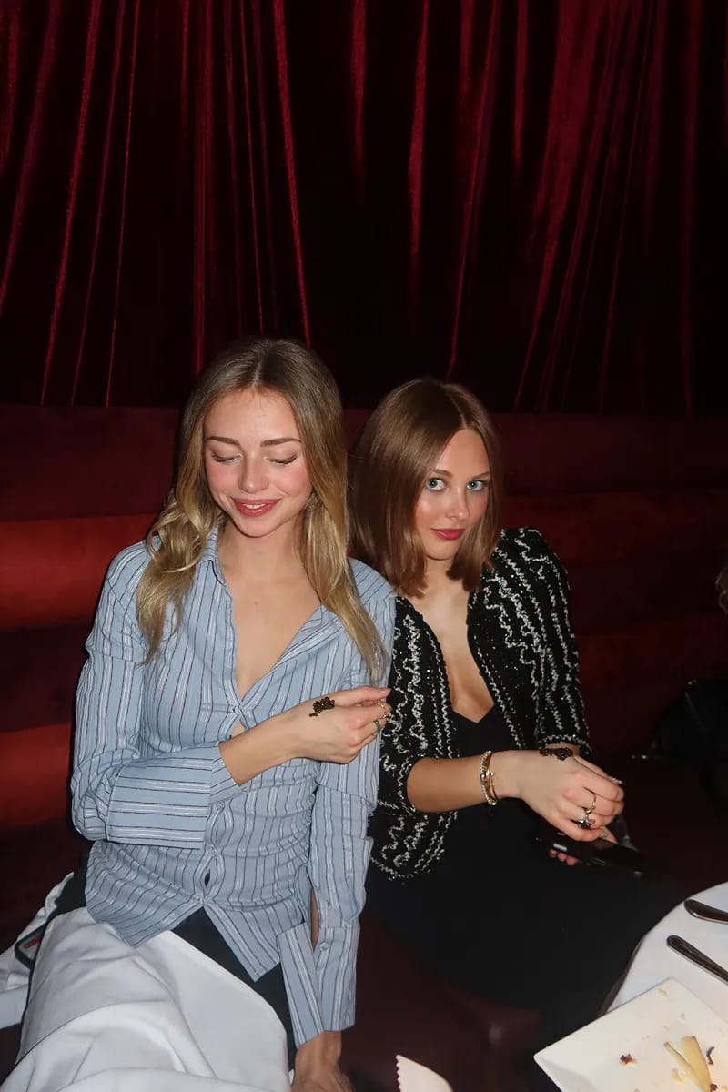 @lolanellie_ @maddieweidman seated against deep red velvet banquettes at Caviar Café during the Tsar Varvatsi tasting event. The intimate lounge setting reflects the refined, luxury atmosphere of the evening in NYC.