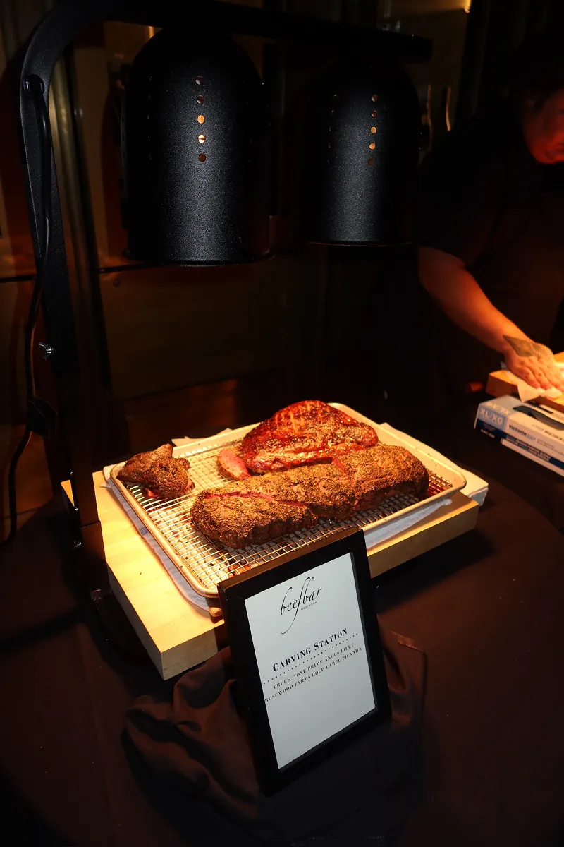 Beefbar NYC carving station featuring premium cuts of steak during the restaurant’s 2-year anniversary celebration with Storytime creators and casino night activities.