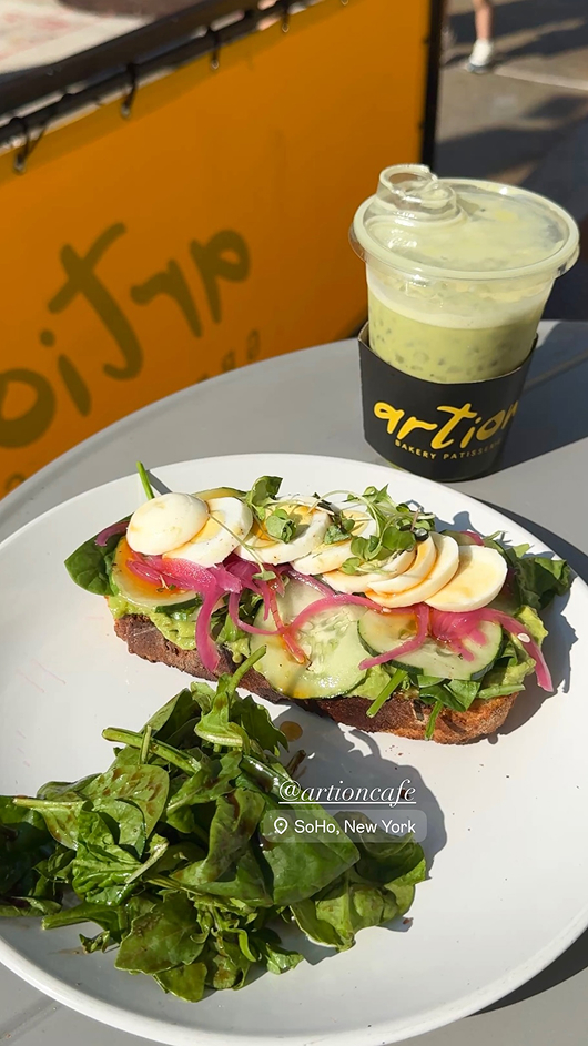A beautiful avocado toast next to a matcha from Artion Cafe in Soho presented by micro-influencer Jess O'niell