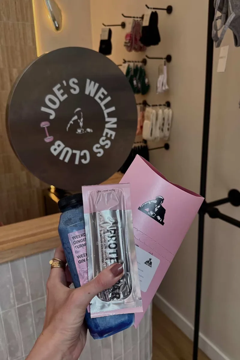Wellness goodies, protein snacks, and juices from Joe & The Juice displayed at the Storytime wellness event hosted at Mouv Pilates Studio in NYC.