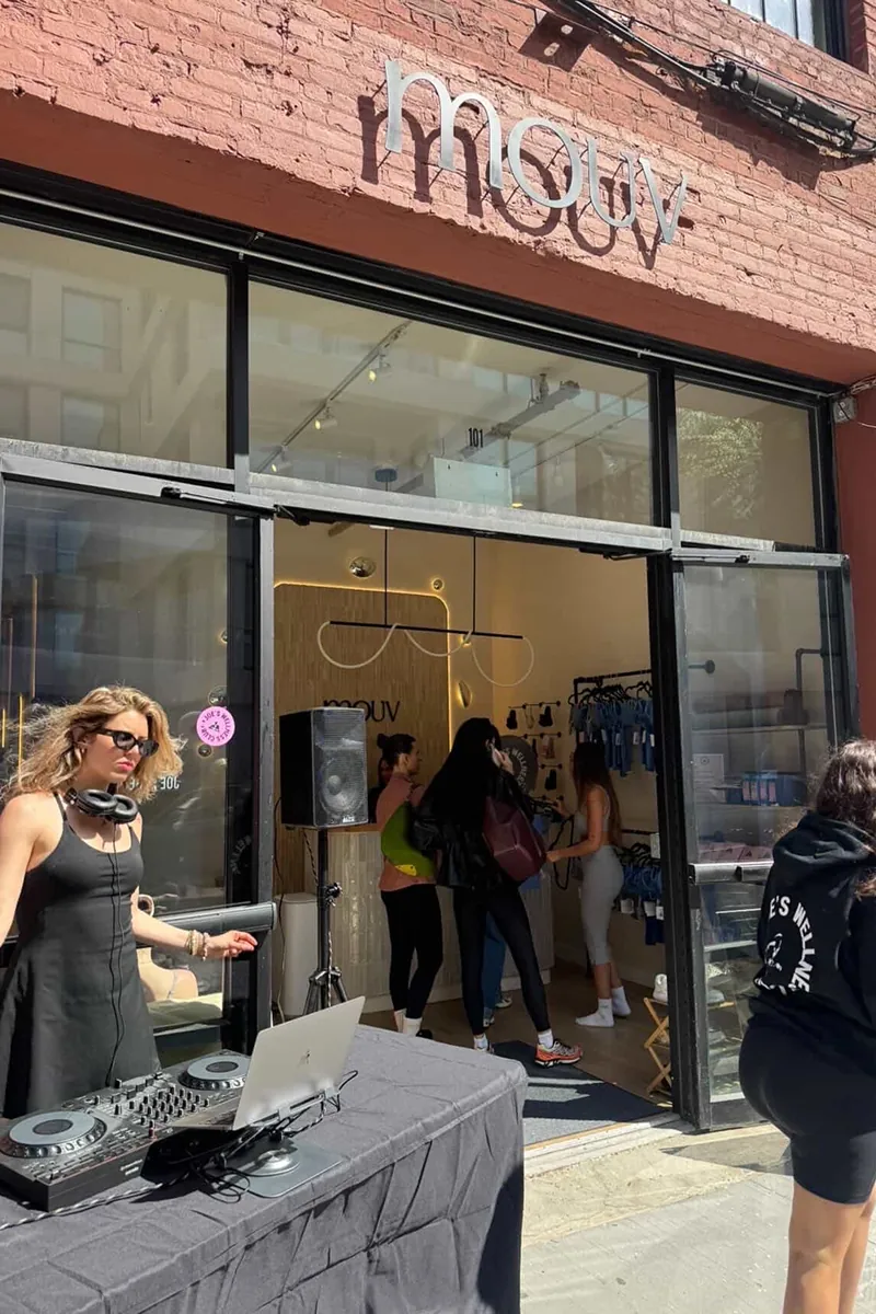 DJ and guests outside Mouv Pilates Studio during the Storytime wellness event with Joe & The Juice in New York City.