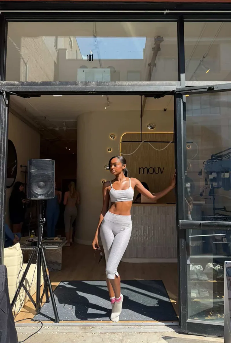Guest arriving at Mouv Pilates Studio in NYC during the Storytime wellness event hosted with Joe & The Juice featuring pilates, community, and wellness experiences.